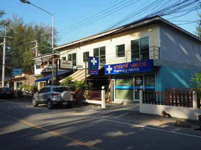 a car parked in front of a building on a street at Rimlay Bungalow in Nai Yang Beach