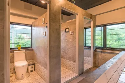 a bathroom with a toilet and a walk in shower at Sanim Hostel in Ao Nang Beach