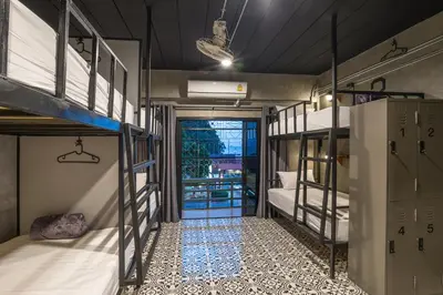 a room with two bunk beds and a doorway at Sanim Hostel in Ao Nang Beach