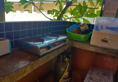 a stove sitting on a counter in a kitchen at 2 Home in Chalong