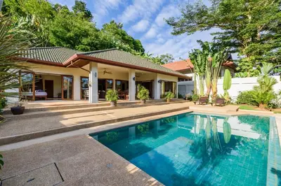 an image of a swimming pool in front of a house at Aster Pool Villa Your Tropical Villa In Paradise in Rawai Beach