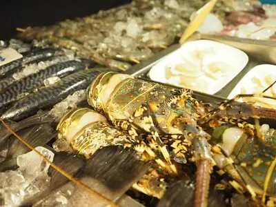 a close up of a lobster on a table at Arita Hotel Patong in Patong Beach