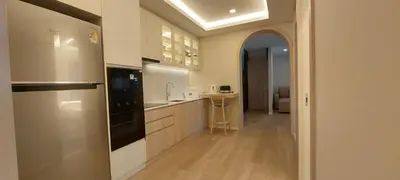 a kitchen with a sink and a stove at The Regent Residence Kamala in Kamala Beach