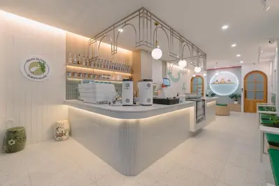 a kitchen with a counter in a store at Baan Sutra Guesthouse in Phuket Town