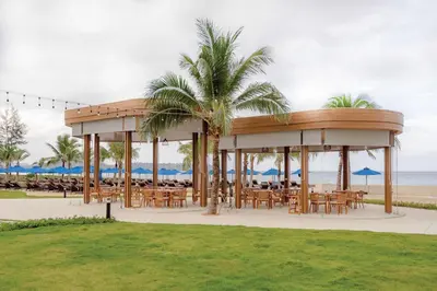 a gazebo with tables and chairs on the beach at Angsana Laguna Phuket in Bang Tao Beach