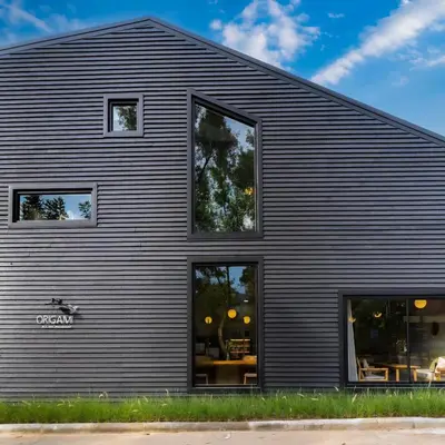 a black building with windows on the side of it at Villa 3 Bedrooms with private pool at Oxygen Bangtao in Bang Tao Beach