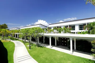 an exterior view of a white building with trees at Villa 3 Bedrooms with private pool at Oxygen Bangtao in Bang Tao Beach