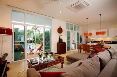 a living room with a couch and a table at Villa 3 Bedrooms with private pool at Oxygen Bangtao in Bang Tao Beach