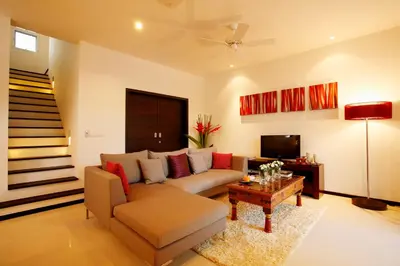 a living room with a couch and a table at Villa 3 Bedrooms with private pool at Oxygen Bangtao in Bang Tao Beach