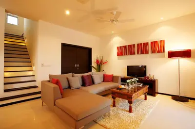a living room with a couch and a table at Villa 4 Bedrooms with private pool at Oxygen Bangtao in Bang Tao Beach