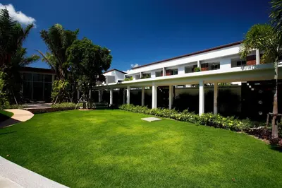 a large lawn in front of a building at Villa 4 Bedrooms with private pool at Oxygen Bangtao in Bang Tao Beach
