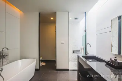 a bathroom with a white tub and a sink at Villa 1 Bedroom with private pool at Wings Pasak in Bang Tao Beach