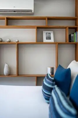 a room with a shelf with blue pillows at Villa 2 Bedrooms with private pool at Wings Pasak in Bang Tao Beach