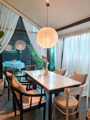 a dining room with a table and chairs at Villa 2 Bedrooms with private pool at Wings Pasak in Bang Tao Beach