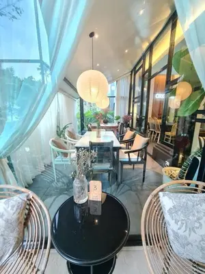 a dining room with a table and chairs at Villa 3 Bedrooms with private pool at Wings Pasak in Bang Tao Beach