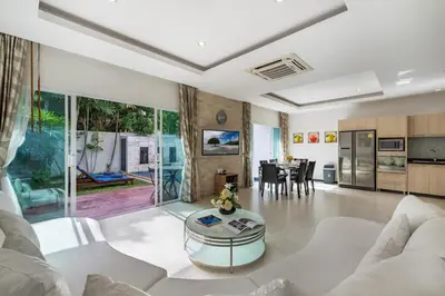 a living room with a couch and a table at Trixie Town House 3 With Private Pool in Rawai Beach