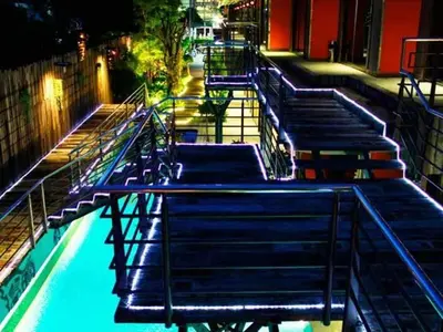 a group of blue stairs with lights on them at Nicky's Handlebar in Patong Beach