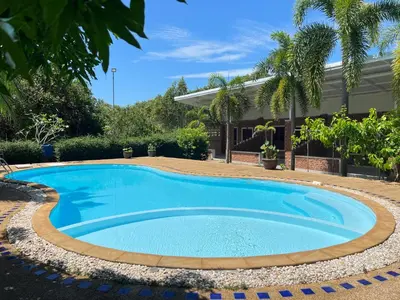 a swimming pool in the yard of a house at Krabi Discovery Resort in Tha Lane Bay