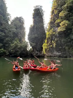 a group of people in kayaks in the water in a bay at Krabi Discovery Resort in Tha Lane Bay