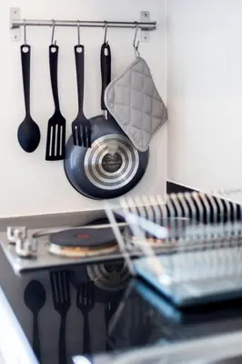 a kitchen with utensils hanging on a wall at Phuket Town 1 Bedroom Condo Luxury Facilities, The Base Downtown in Phuket Town