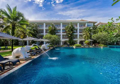 a pool at a resort with animals in the water at Naithonburi Beach Resort - SHA Extra Plus in Nai Thon Beach