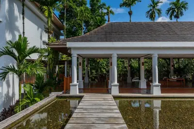 a house with a pool and a pavilion at Naithonburi Beach Resort - SHA Extra Plus in Nai Thon Beach