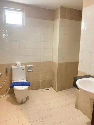 a bathroom with a toilet and a sink at Holiday Home Patong in Patong Beach