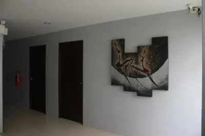 a painting on a wall in a room at Holiday Home Patong in Patong Beach