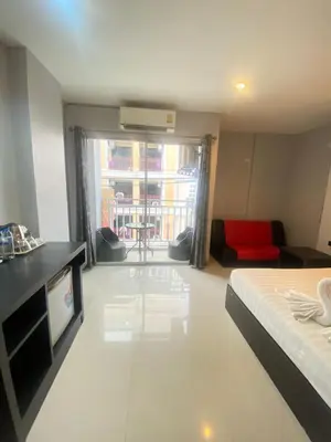 a large room with a bed and a living room at Holiday Home Patong in Patong Beach