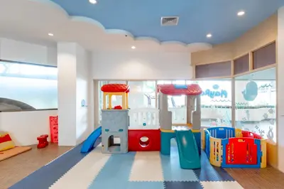a childrens play room with a playground at Andaman Embrace Patong, Phuket in Patong Beach