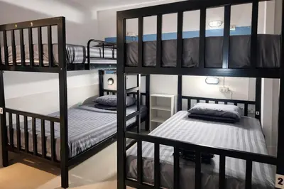 a bunk bed room with two bunk beds at Happy Fish Guesthouse in Patong Beach