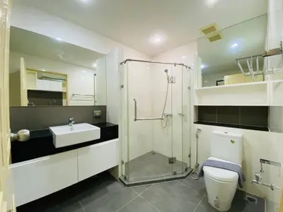 a bathroom with a shower and a toilet and a sink at The Unity Patong in Patong Beach
