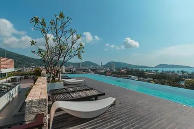 a swimming pool on top of a building at The Unity Patong in Patong Beach