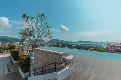 a view from the roof of a building with a swimming pool at The Unity Patong in Patong Beach