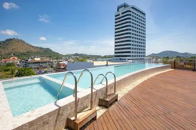 a swimming pool on the roof of a building at EcoLoft Hotel - SHA Plus in Phuket Town