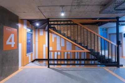 a staircase in a building with a number four at EcoLoft Hotel - SHA Plus in Phuket Town