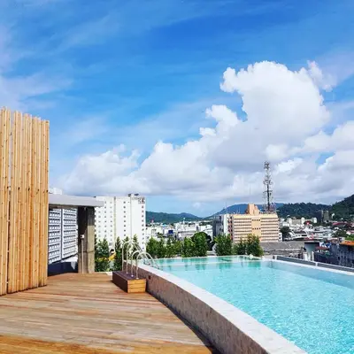 a swimming pool on the roof of a building at EcoLoft Hotel - SHA Plus in Phuket Town