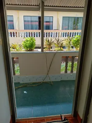 a view from the balcony of a house with a room at Nit Guest House in Kata Beach