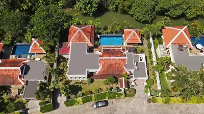 an aerial view of a house at Tropical Living at 3BR Pool Villa Bianca, Baan Bua Luxury Estate, Nai Harn Beach in Rawai Beach