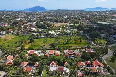 an aerial view of a city with houses at Tropical Living at 3BR Pool Villa Bianca, Baan Bua Luxury Estate, Nai Harn Beach in Rawai Beach