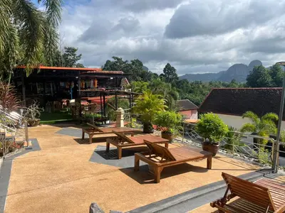 a group of benches sitting on top of a building at Krabi Villa Phu Khao Private Resort in Klong Muang Beach