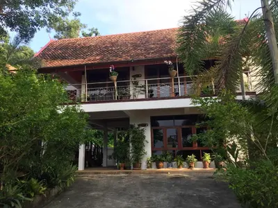 a view of the front of a house with plants at Krabi Villa Phu Khao Private Resort in Klong Muang Beach