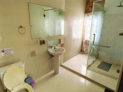 a bathroom with a toilet and a sink and a shower at Thai family rawai Swimming pool villa Hotel in Rawai Beach