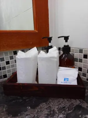 a tray of toilet paper in a bathroom at SB Living Place Hotel Phuket Town in Phuket Town