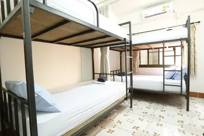 two bunk beds in a hostel room at Baan Kamala Backpacker in Kamala Beach