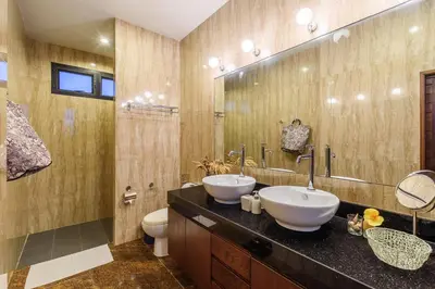 a bathroom with two sinks and a large mirror at Perfect 3br Pool Villa by Intira Villas in Rawai Beach