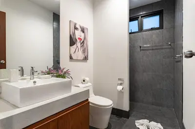 a bathroom with a sink and a toilet and a shower at Modern 3br Boutique Pool Villa by Intira Villas in Rawai Beach