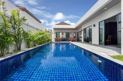 a swimming pool in the backyard of a villa at Large 3br Boutique Villa with big Pool by Intira Villas in Rawai Beach
