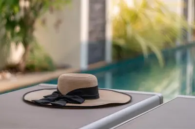 a brown hat with a black bow tie sitting on a table at Thai-Themed 3br Boutique Villa by Intira Villas in Rawai Beach