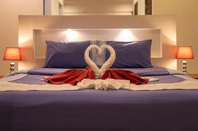 a bed with two swans made out of towels at Thai-Themed 3br Boutique Villa by Intira Villas in Rawai Beach